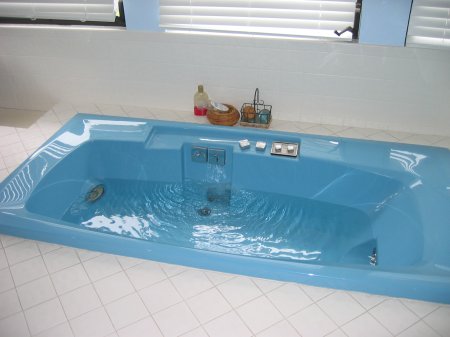 A bathtub being filled with water